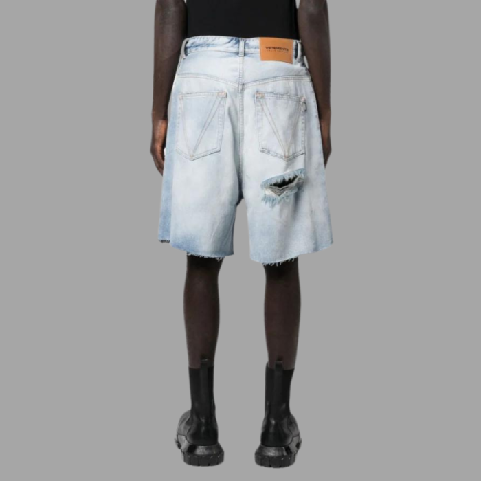 VETEMENTS ripped-detailed denim shorts